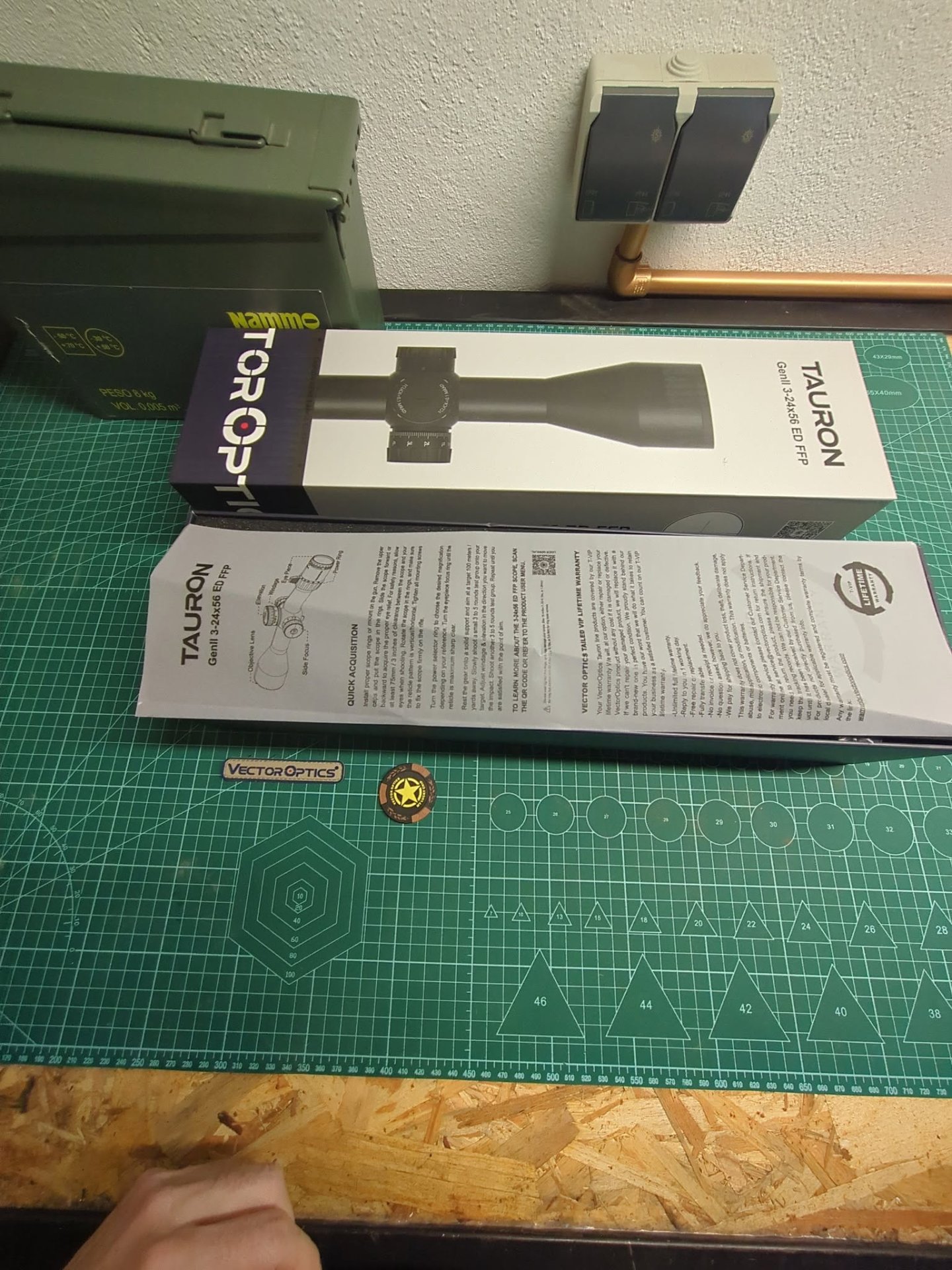Tauron GenII 3-24x56 ED FFP box opened with the user manual on top