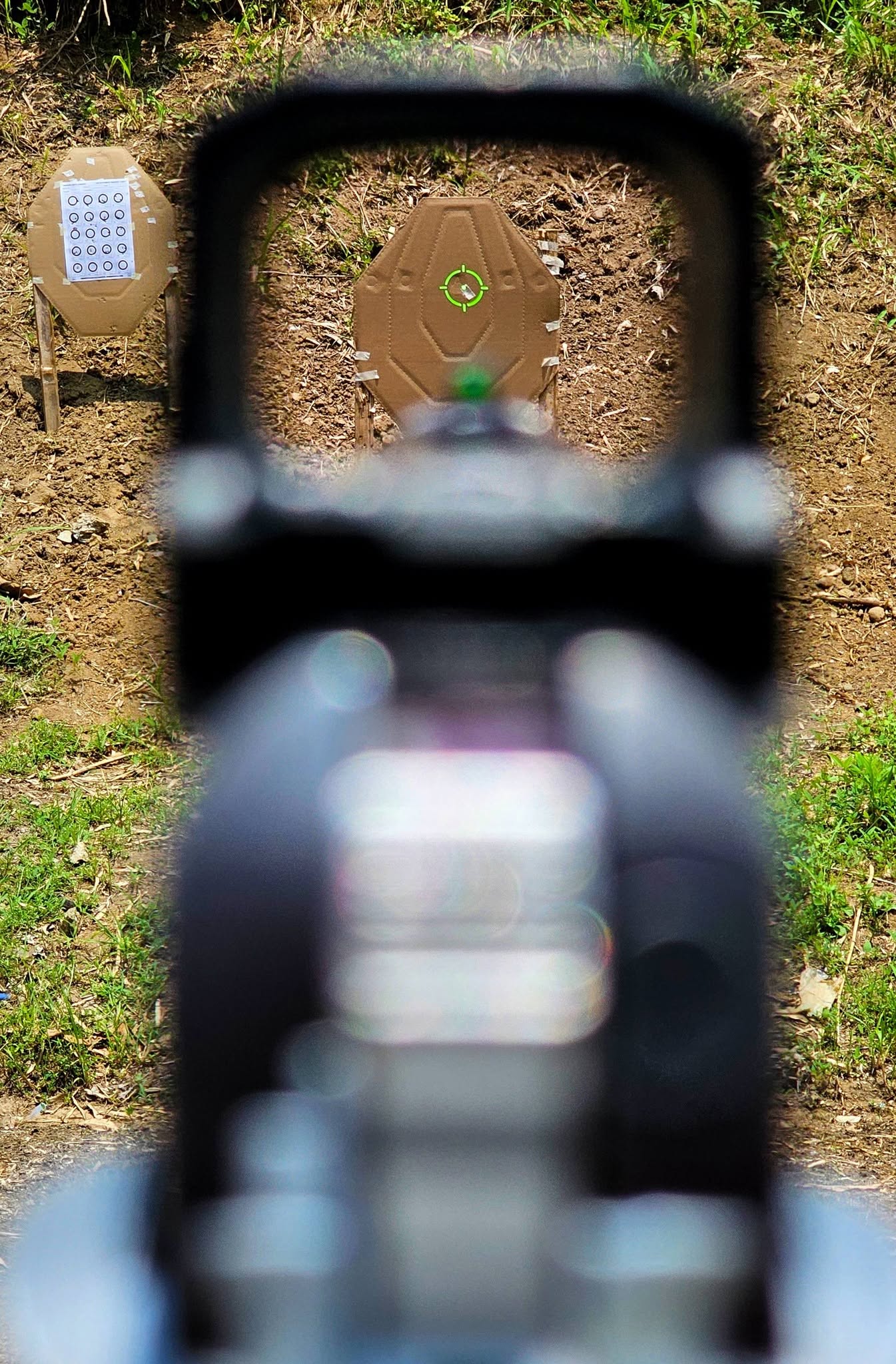 View through the SCRD-GM68 green circle-dot reticle on a target at the range