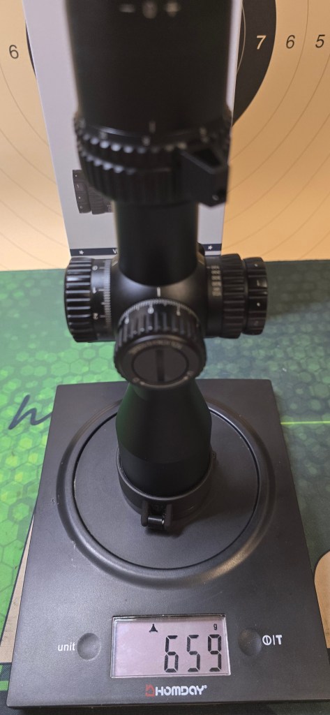 Veyron GenII 3-12x44 HD CTR FFP Rifle Scope weighed on a scale